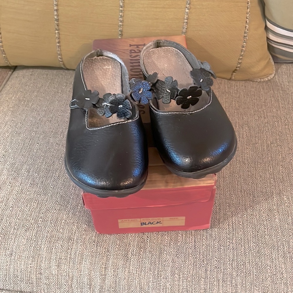 Black mules with floral straps